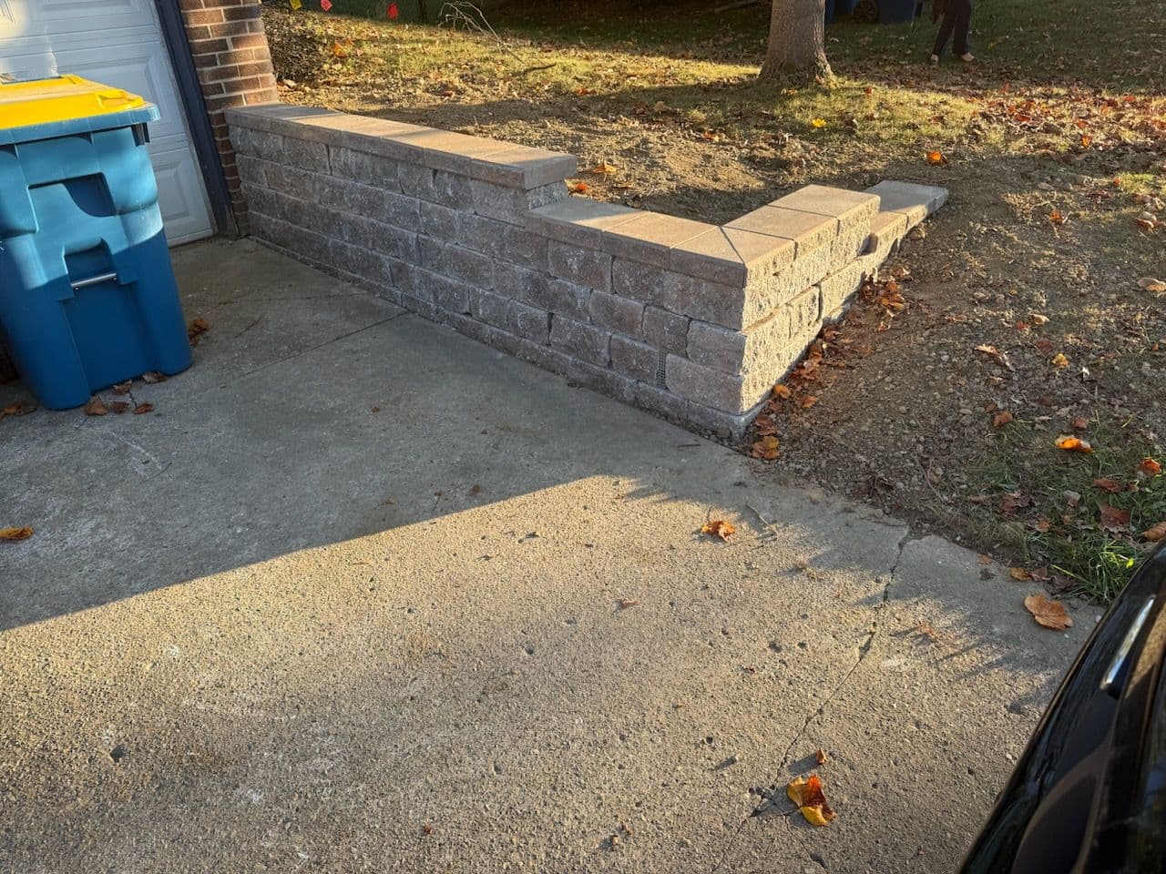 Elegant Stacked Stone Retaining Wall for Enhanced Outdoor Spaces image