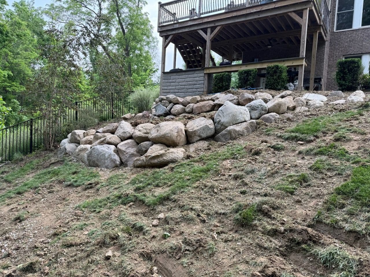 Transform Sloped Yard with Sturdy Retaining Wall image