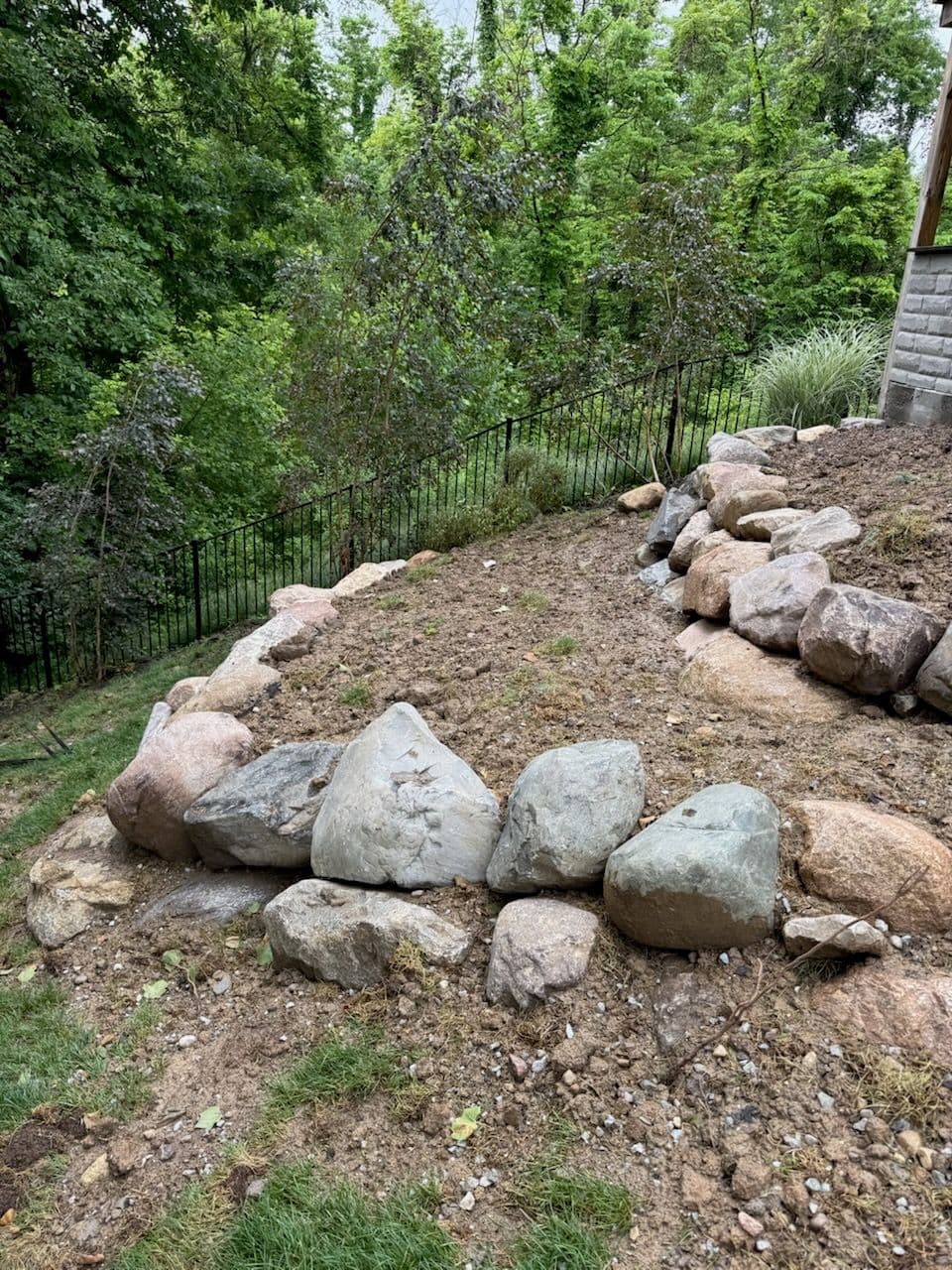 Rustic Stone Retaining Wall Enhances Landscape image